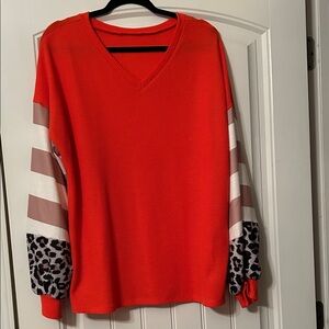 Vibrant Orange V-Neck Women's Top with Striped and Leopard Sleeves